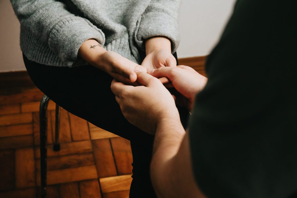 picture of two peoples hands holding clasped